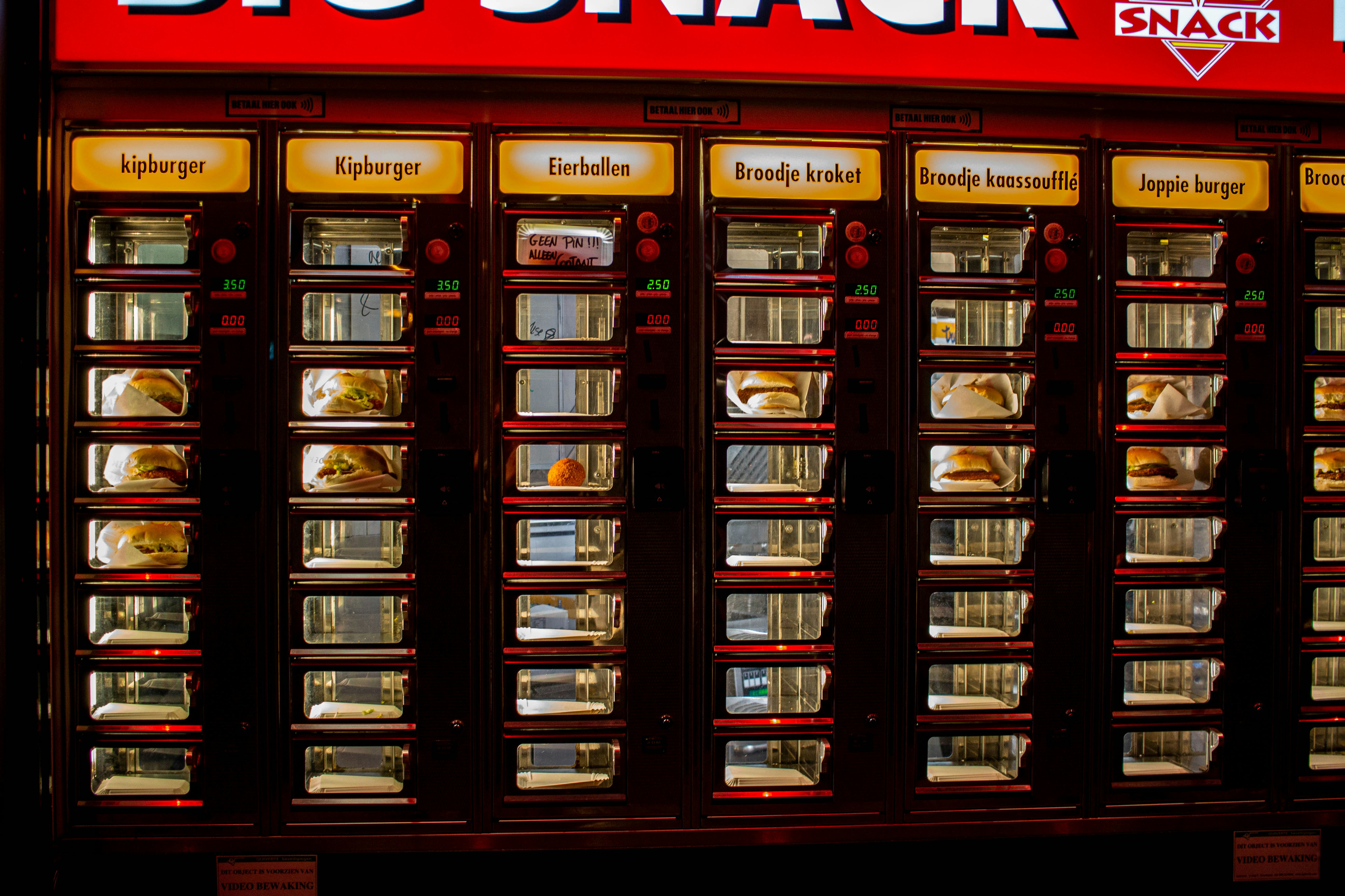 a big snack vending machine in front of a store